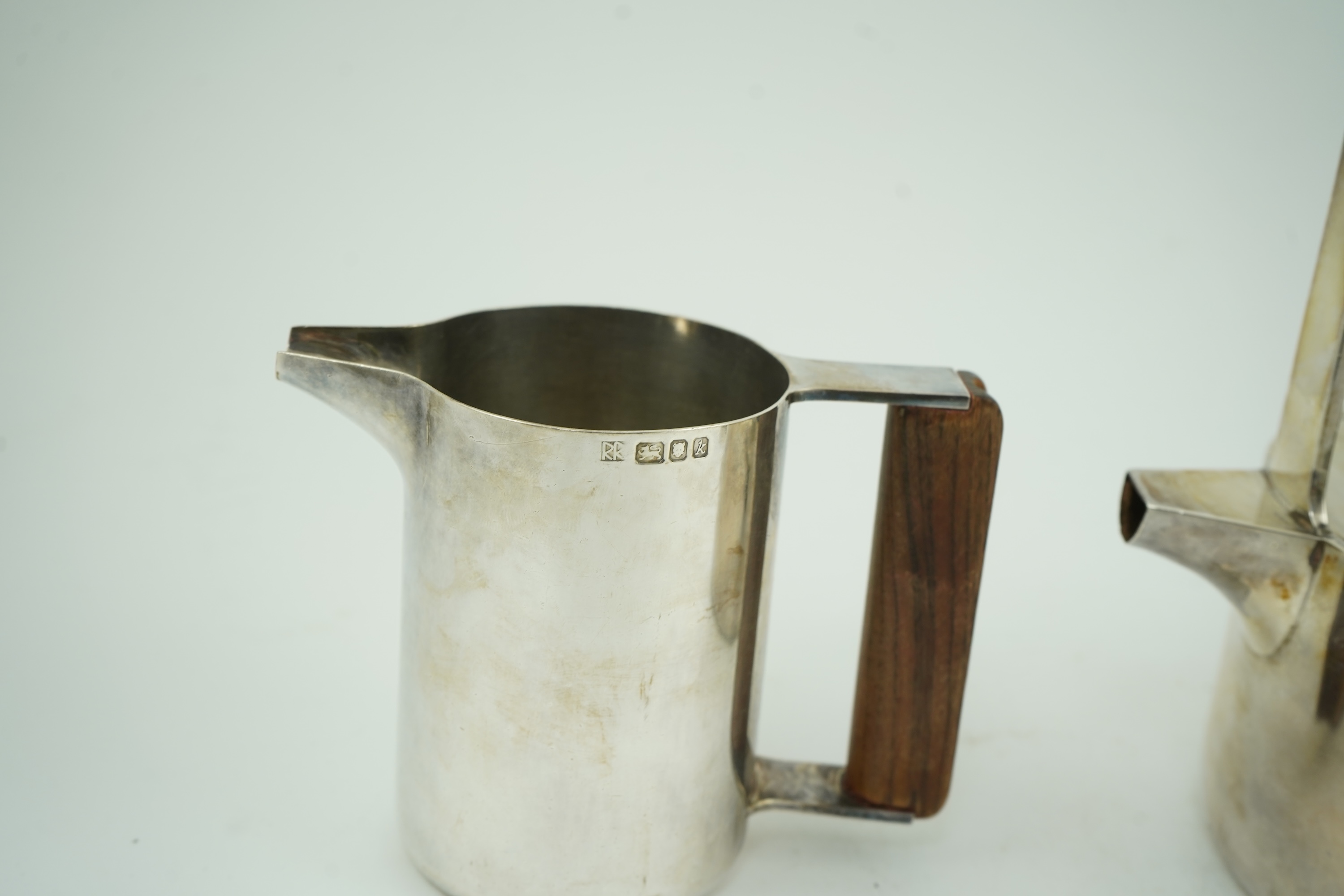 Roy Ridsdale (1942-2020): A silver tea kettle and matching cream jug